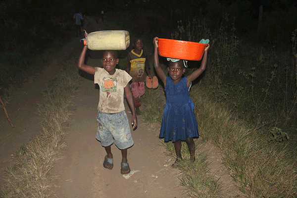 Children carrying water