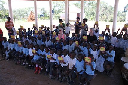 Presenting the Tales of Nabugabo to the pupils and staff at NCLC